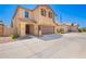 Charming two-story home with a two-car garage, landscaped with desert rock and easy care shrubs at 5113 E Greenway E St, Mesa, AZ 85205