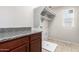 The convenient laundry room features granite countertops and lots of shelving space at 5113 E Greenway E St, Mesa, AZ 85205