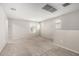 This spacious loft features carpet, neutral paint, and an open layout with bright natural light at 5113 E Greenway E St, Mesa, AZ 85205