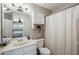 Clean bathroom with a vanity, toilet, and shower with white shower curtain at 520 N Stapley Dr # 134, Mesa, AZ 85203