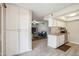 Open kitchen featuring granite countertops and tile flooring, seamlessly connected to the living area at 520 N Stapley Dr # 134, Mesa, AZ 85203