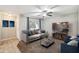 Comfortable living room with neutral tones, a ceiling fan, and natural light from the window at 520 N Stapley Dr # 134, Mesa, AZ 85203