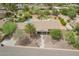 Aerial view showcasing the home's manicured front yard and the surrounding neighborhood at 6102 E Aster Dr, Scottsdale, AZ 85254