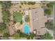 Aerial view highlighting the pool, turf, outdoor kitchen, fire pit, and other outdoor amenities at 6102 E Aster Dr, Scottsdale, AZ 85254