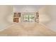 Entertainment area featuring bar cabinets, granite counters, tile floors, and patio access at 6102 E Aster Dr, Scottsdale, AZ 85254