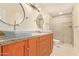 Elegant bathroom with dual sinks, granite countertops, and a glass-enclosed shower for a modern feel at 6102 E Aster Dr, Scottsdale, AZ 85254