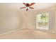 Neutral bedroom with a ceiling fan and a bright window featuring outdoor views and lots of sunlight at 6102 E Aster Dr, Scottsdale, AZ 85254