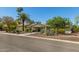 Single-story house featuring mature landscaping, desert plants, and a clear blue sky at 6102 E Aster Dr, Scottsdale, AZ 85254