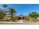 Inviting single-story residence featuring beautiful desert landscaping, mature trees, and inviting curb appeal at 6102 E Aster Dr, Scottsdale, AZ 85254
