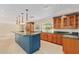 Bright kitchen featuring an island, custom cabinetry, and ample counter space at 6102 E Aster Dr, Scottsdale, AZ 85254
