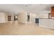 Spacious living room with tiled flooring, neutral walls, and a view towards other rooms at 6102 E Aster Dr, Scottsdale, AZ 85254