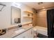 The bathroom features a granite countertop and a shower and tub combination with a tile surround at 620 N 4Th Ave # 10, Phoenix, AZ 85003