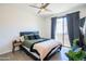 This comfortable bedroom features a ceiling fan, and a sliding glass door to a balcony at 620 N 4Th Ave # 10, Phoenix, AZ 85003