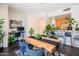 Bright dining area with a wooden table, stylish chairs, a workspace, and lots of plants at 620 N 4Th Ave # 10, Phoenix, AZ 85003