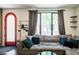 Bright living room featuring a large window, comfortable sofa, and view of the entryway at 620 N 4Th Ave # 10, Phoenix, AZ 85003