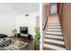 Open-concept living room features a staircase and stylish decor at 620 N 4Th Ave # 10, Phoenix, AZ 85003