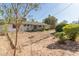 The backyard features a covered patio, desert landscaping and plenty of room for customization at 6820 E Pinchot Ave, Scottsdale, AZ 85251