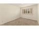 Bedroom with neutral carpet, shuttered window and recessed lighting at 6820 E Pinchot Ave, Scottsdale, AZ 85251