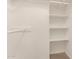 Walk-in closet with built-in shelving and a clothing rod for optimal organization at 6820 E Pinchot Ave, Scottsdale, AZ 85251