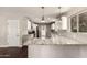Well-appointed kitchen with white cabinets, granite countertops, and stainless steel appliances at 6820 E Pinchot Ave, Scottsdale, AZ 85251