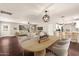 Open-layout living area with kitchen view, modern furnishings, and hardwood floors at 6820 E Pinchot Ave, Scottsdale, AZ 85251