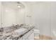 Bathroom featuring granite countertops and white subway tile at 7139 W Mcrae Way, Glendale, AZ 85308