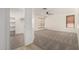 Large bedroom boasts neutral carpet and leads to walk-in closet with convenient shelving at 7139 W Mcrae Way, Glendale, AZ 85308