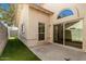 This exterior view shows the architectural window and slider access to the patio area at 7139 W Mcrae Way, Glendale, AZ 85308
