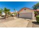 Single-story home featuring a neutral color scheme, two car garage, desert landscaping, and a red tile roof at 7139 W Mcrae Way, Glendale, AZ 85308
