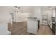 Open concept kitchen with stainless appliances and lots of natural lighting at 7139 W Mcrae Way, Glendale, AZ 85308