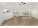 Spacious living room with bright lighting, ceiling fan, and vinyl flooring at 7139 W Mcrae Way, Glendale, AZ 85308