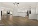 Open-concept space featuring kitchen and fireplace with vinyl flooring at 7139 W Mcrae Way, Glendale, AZ 85308