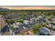 Scenic aerial view of a charming neighborhood with lush greenery and diverse architectural styles at 7610 N Via De Manana Dr, Scottsdale, AZ 85258