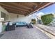 Charming covered patio with wicker seating and brick paver flooring at 7610 N Via De Manana Dr, Scottsdale, AZ 85258