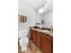 Well-lit bathroom featuring a vanity with granite countertop and warm cabinet colors at 7610 N Via De Manana Dr, Scottsdale, AZ 85258