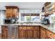 Bright kitchen featuring wood cabinets, granite countertops, and stainless steel appliances at 7610 N Via De Manana Dr, Scottsdale, AZ 85258