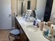Bathroom featuring an extended vanity with dual sinks, and a black and white decorative stool at 774 E Morningside Dr, Phoenix, AZ 85022