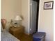 This bedroom features neutral walls, a wood nightstand and closet for storage at 774 E Morningside Dr, Phoenix, AZ 85022