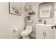 Stylish half bathroom features modern vanity and decorative wall decor at 7858 W Fetlock Trl, Peoria, AZ 85383