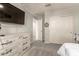 Bright bedroom with carpet flooring, ceiling fan, and plenty of storage space at 7858 W Fetlock Trl, Peoria, AZ 85383