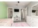Well-lit bedroom with TV, closet, dresser, soft carpet, and neutral wall tones at 7858 W Fetlock Trl, Peoria, AZ 85383