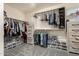 Spacious walk-in closet with custom shelving and ample storage space at 7858 W Fetlock Trl, Peoria, AZ 85383