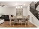 Cozy dining area with natural light and a view of the staircase, great for Gathering meals at 7858 W Fetlock Trl, Peoria, AZ 85383