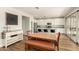 Spacious kitchen with white cabinets, granite counters, and stainless steel appliances at 7858 W Fetlock Trl, Peoria, AZ 85383