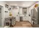 Bright kitchen with stainless steel appliances, white cabinets, and a dining area at 7858 W Fetlock Trl, Peoria, AZ 85383