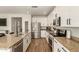 Kitchen featuring granite counters, stainless steel appliances and white cabinets at 7858 W Fetlock Trl, Peoria, AZ 85383