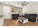 Bright and airy living room showcasing hardwood floors and ample space for relaxing and entertaining at 7858 W Fetlock Trl, Peoria, AZ 85383