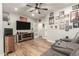 Spacious living room with entertainment center and wall decor, cozy for relaxing and entertaining at 7858 W Fetlock Trl, Peoria, AZ 85383