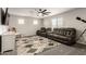 Spacious living room features a fan and a comfortable seating area at 7858 W Fetlock Trl, Peoria, AZ 85383