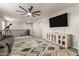 Upstairs living area, complete with media center, lounge seating and telescope at 7858 W Fetlock Trl, Peoria, AZ 85383